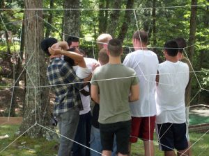 men at English Mountain doing ropes course