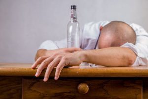 man passed out at bar
