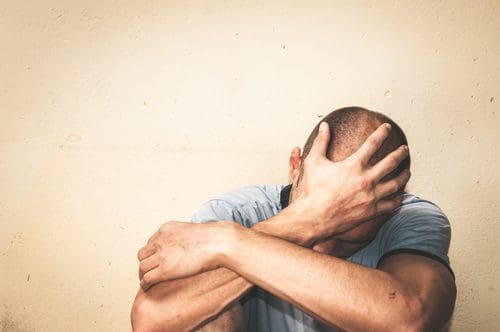 Men and Addiction, upset man covering his face