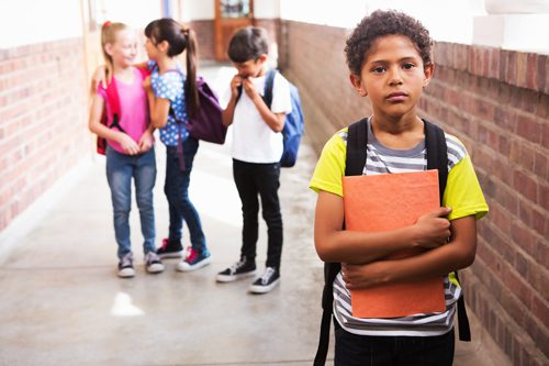 young boy being bullied at school - traumatic