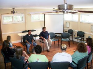 several people sitting in circle - group therapy - English Mountain Recovery
