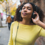 woman listening to music with headphones