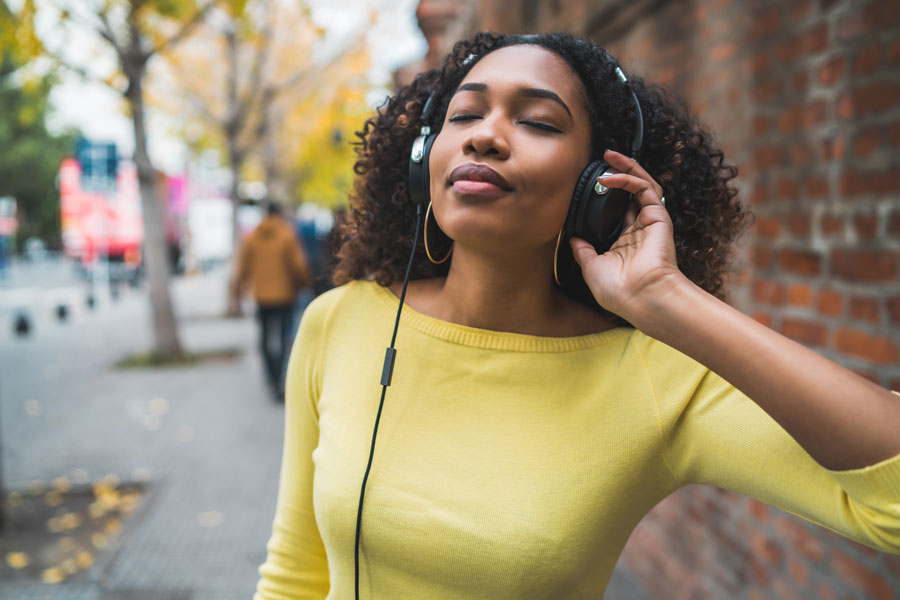 woman listening to music with headphones