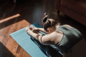 A woman practicing yoga.