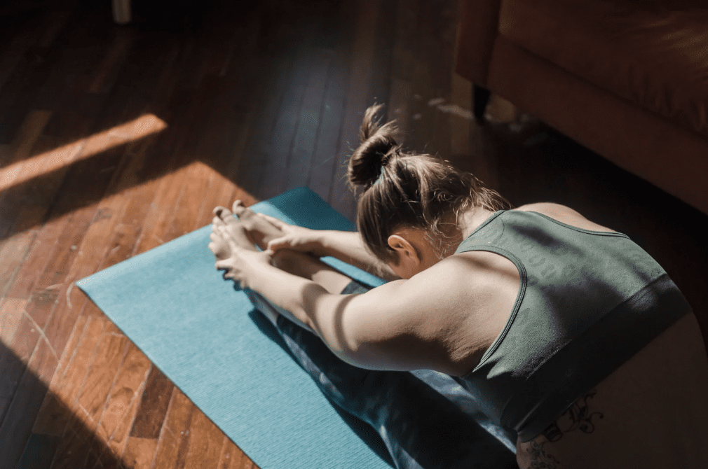 A woman practicing yoga.